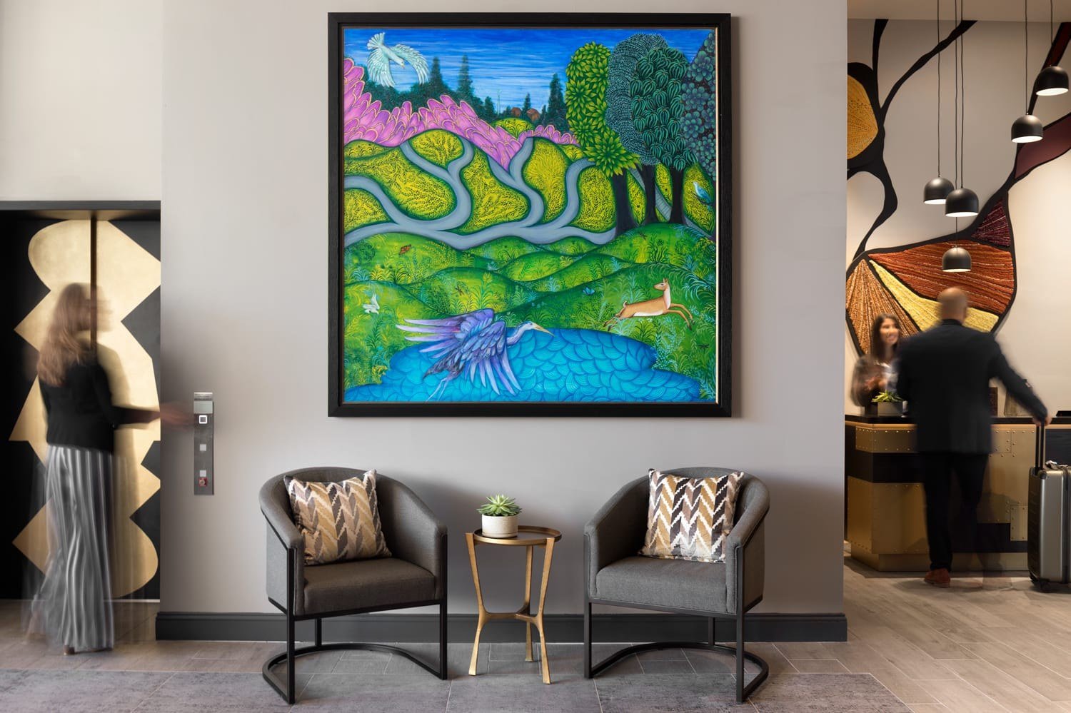 Lobby lounge seating and curated art at The MC Hotel